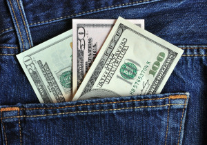 money sticky out of back pocket