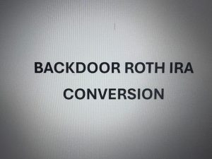 Person reviewing retirement account documents and planning a Roth IRA Conversion.