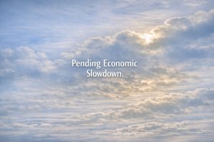 Clouds partially covering the sun to illustrate a pending economic slowdown.